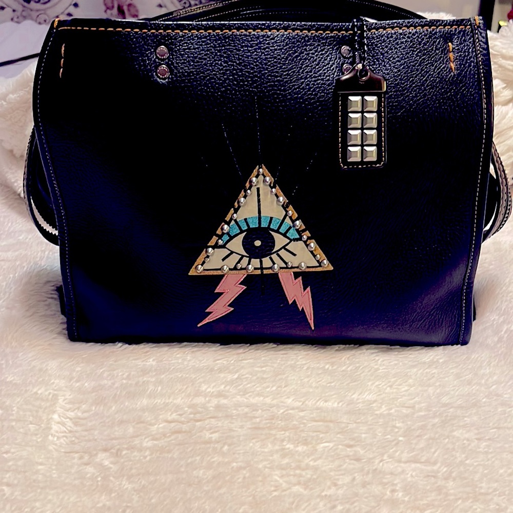 Rogue with pyramid eye Coach purse. Not available online/in stores anymore!